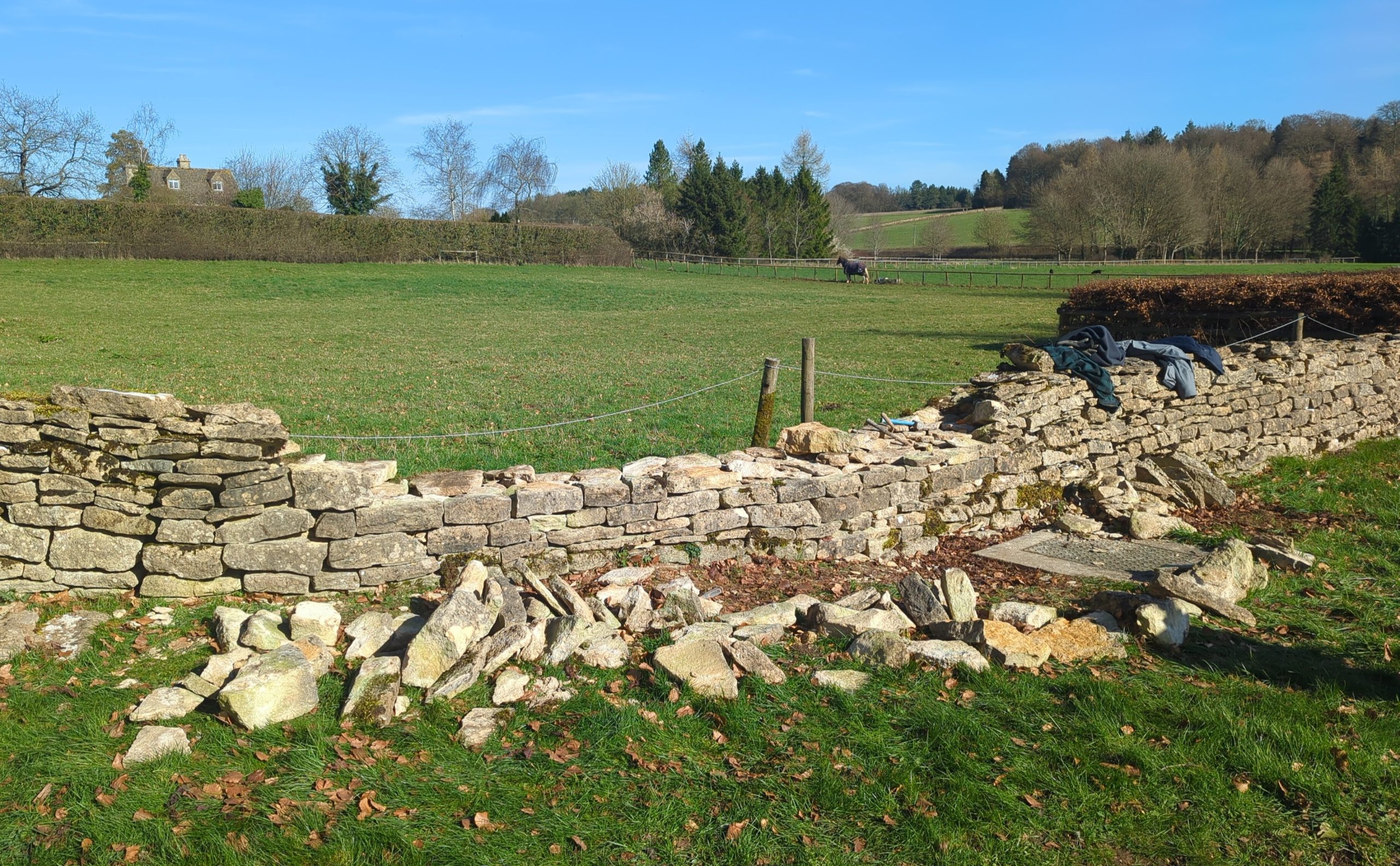Repair and rebuild of a dry stone field wall in Tetbury, Gloucestershire, Cotswolds
