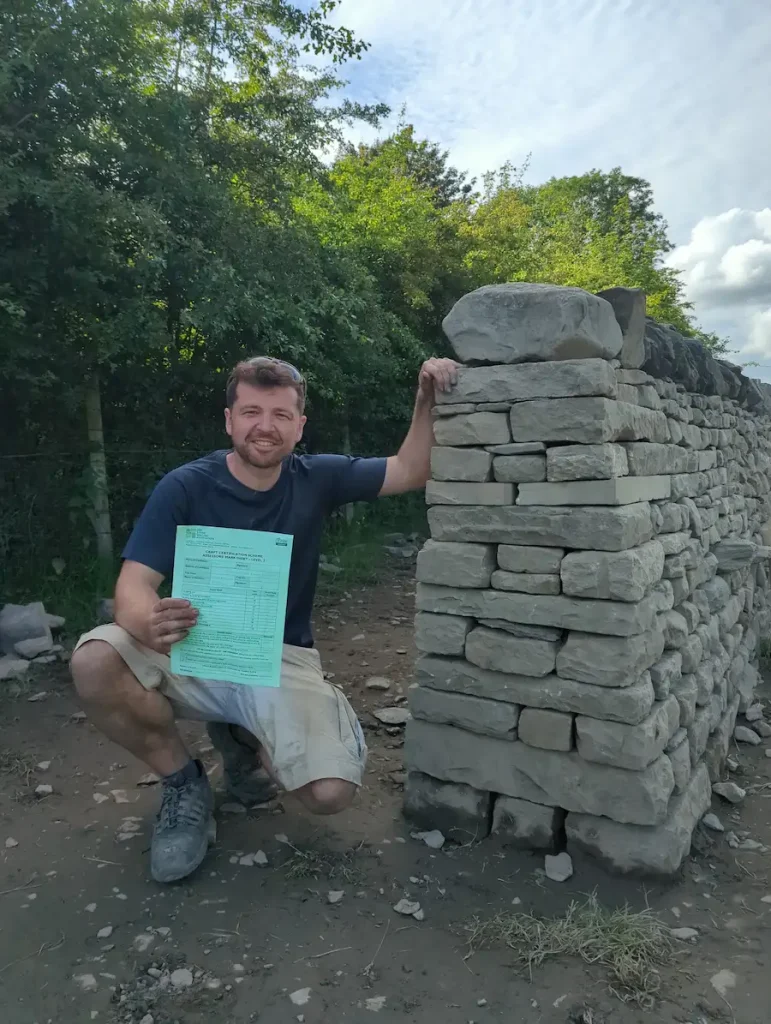 Joe from Stroud, Gloucestershire and The Cotswolds becoming a Level 2 Professionally Accredited DSWA Dry Stone Walling Association Member