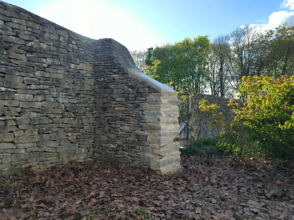 Completed dry stone walling with a mortared wall head in Sherston near Tetbury.